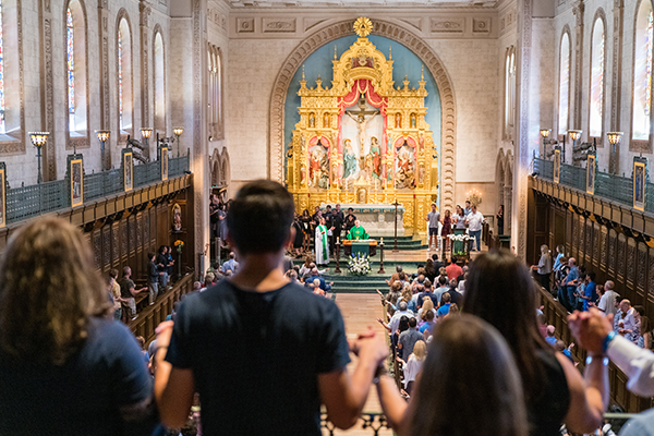 Families at a USD Homecoming mass